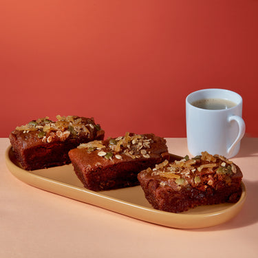 Three slices of Sticky Ginger Loaf on a plate